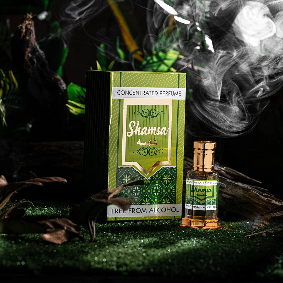 Shamsa concentrated perfume bottle and box with smoke in a dark natural setting